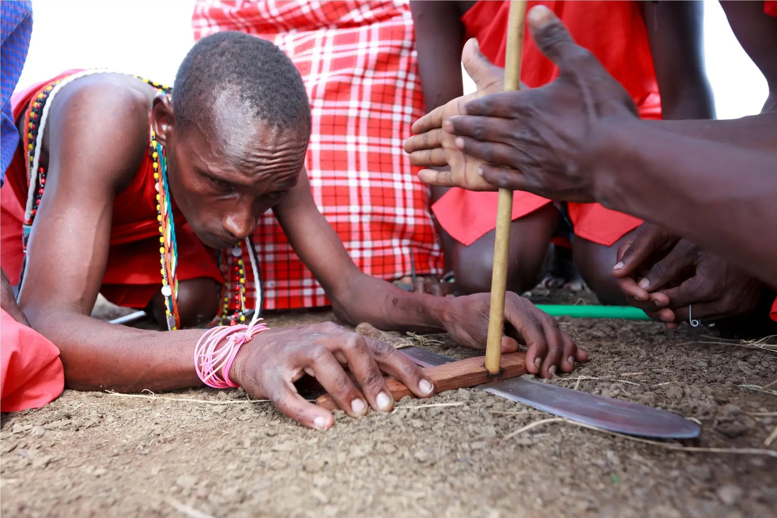 Maasai elders demonstrating fire-making.